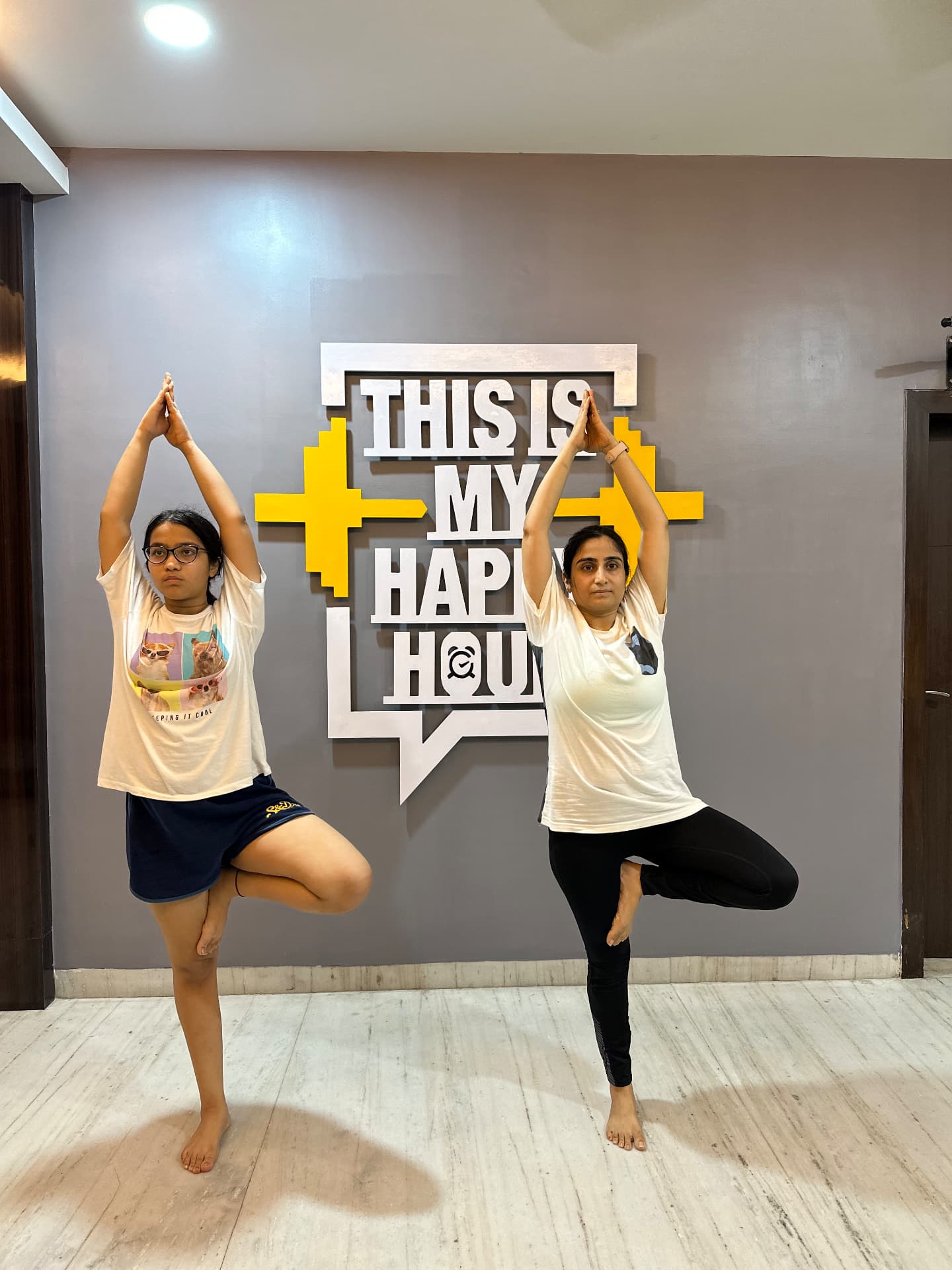 Sarvya Yoga students practicing tree pose during a community class